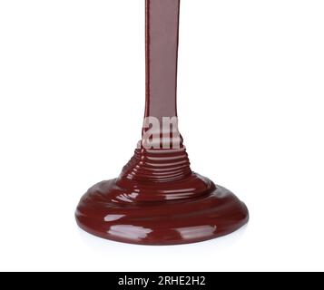 Melted chocolate dripping on white background close-up Stock Photo