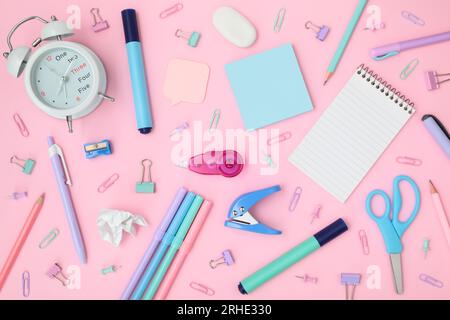 School and office supplies on pink background, mock-up top view close-up Stock Photo
