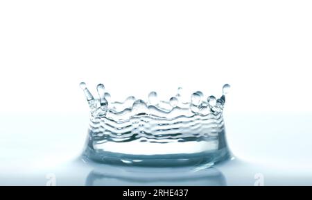Water splash like crown on white background close-up Stock Photo