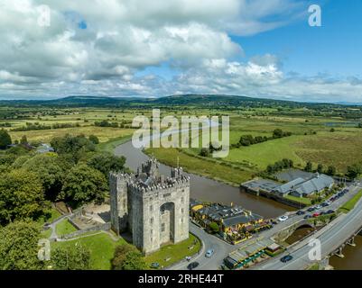 Aerial view of Bunratty Castle  large 15th-century tower house in County Clare in Ireland guarding the crossing on the Ralty river before it reaches t Stock Photo