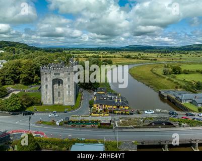 Aerial view of Bunratty Castle  large 15th-century tower house in County Clare in Ireland guarding the crossing on the Ralty river before it reaches t Stock Photo