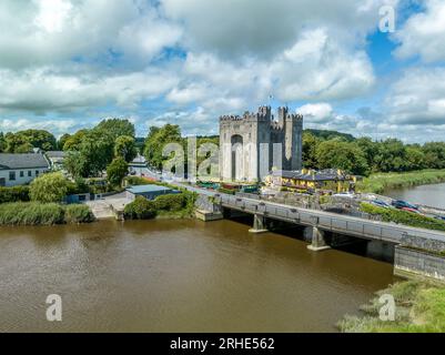 Aerial view of Bunratty Castle  large 15th-century tower house in County Clare in Ireland guarding the crossing on the Ralty river before it reaches t Stock Photo