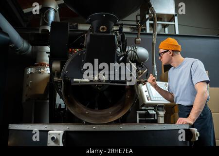 Modern coffee roasting factory, process of creating coffee. Stock Photo