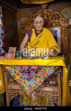 India, Ladakh, Leh Valley, Thiksey Gompa, Lhakang, life sized cutout of HH Dalai Lama in abbot’s chair Stock Photo