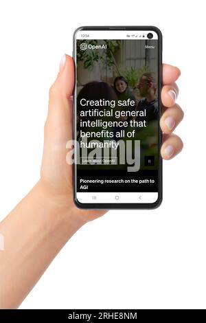 Kiev, Ukraine - March 07, 2023: OpenAI Website Home Page on phone screen in hand. OpenAI is a non-profit artificial intelligence research organization Stock Photo
