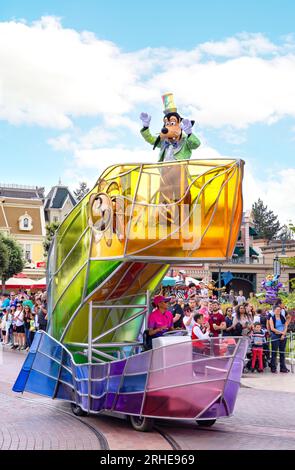 Disneyland Paris parade - Goofy character on a colourful vehicle in the disney parade; Disneyland Paris in summer, France Europe Stock Photo