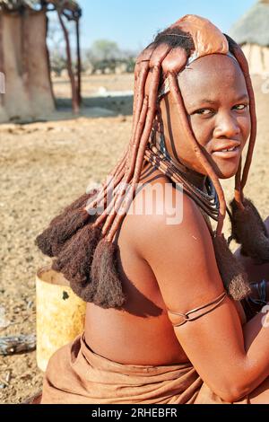 Namibia. The life in a Himba Village. Kunene Region. The traditional hair headdress of a woman Stock Photo