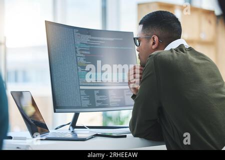 Man, computer screen and thinking of coding, programming or software development and online solution. Programmer or developer reading html script Stock Photo