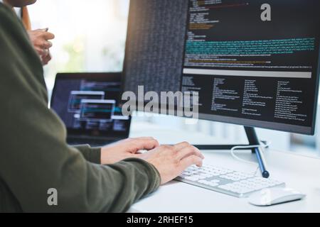 Programming, developer and hands on computer for coding, software script or cyber security in office. Closeup of IT technician person with technology Stock Photo
