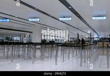 Passport control area. Passport control stands at the Bahrain airport. Other nationalities sign. Stock Photo