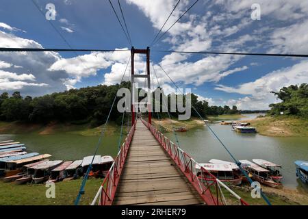 Rangamati, Bangladesh - July 25, 2023: A Hanging Bridge on Kaptai Lake in Rangamati. Kaptai Lake is a people made lake in south-eastern Bangladesh. It Stock Photo