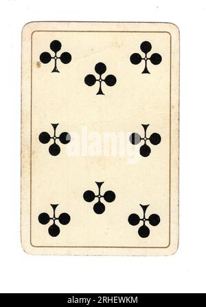 An antique eight of clubs playing card on a white background. Stock Photo