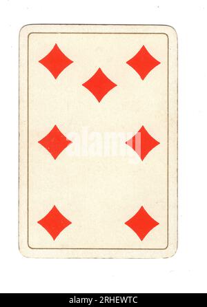 An antique seven of diamonds playing card on a white background. Stock Photo