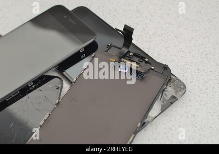 Closeup of a smartphone display, highlighting the concept of cell phone maintenance and repair. Great for illustrating the universe of technical assis Stock Photo