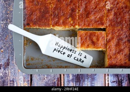 A serving or slice of Orange Pie. This is a Greek specialty known as Portokalopita. Its made with phyllo pastry and soaked in an orange syrup Stock Photo