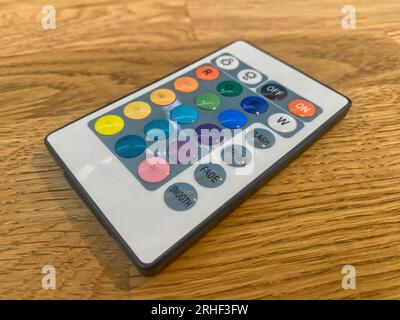 Remote control on a wooden table Stock Photo
