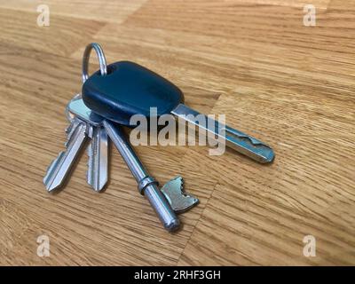 Set of keys on a wooden table Stock Photo
