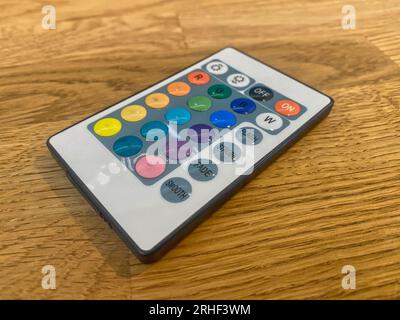 Remote control on a wooden table Stock Photo