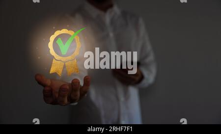 Hand shows the sign of the top service quality assurance 5-star guarantee good service, premium, high quality, business excellence. Stock Photo