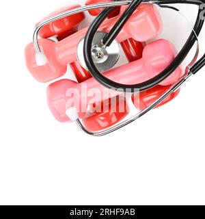 Set of dumbbells and stethoscope isolated on white background. Sports equipment. Health care concept. Free space for text. Stock Photo