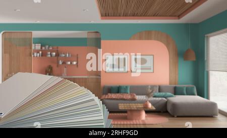 Color palette close up sample. Paint selection catalog over interior design scene, modern wooden kitchen and living room in orange and turquoise tones Stock Photo