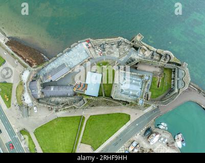 Aerial view of Carrickfergus Castle Anglo Norman castle in Northern Ireland, in County Antrim, on the northern shore of Belfast Lough with large recta Stock Photo