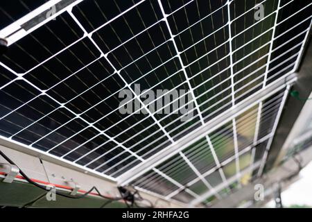 Back side of solar panel, photovoltaic, alternative electricity source - concept of sustainable resources. Landscape of solar panels at solar power Stock Photo