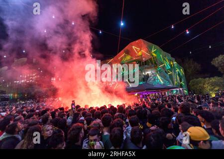 Melbourne, Australia. 16th Aug, 2023. Red smoke flares seen in the crowd as Matildas fans watch the game at Federation Square during the Women's World Cup semifinal in Melbourne. Australian and English soccer fans gather at Federation Square to share in the exhilarating highs and heart-wrenching lows of the World Cup semifinal clash. Flags wave, cheers resonate, and emotions intertwine as these passionate supporters unite in their love for the game, watching the Lionesses win 3 :1 against the Matildas. Credit: SOPA Images Limited/Alamy Live News Stock Photo