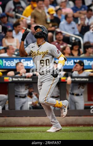 Aug 15, 2023; New York City, New York; Pittsburgh Pirates short stop Liover  Peguero (60) hits solo home run off New York Mets pitcher David Peterson  (23). (Ariel Fox/Image of Sport) Credit