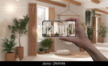 Hand holding smart phone, AR application, simulate furniture and interior design products in real home, architect designer concept, blur background, l Stock Photo