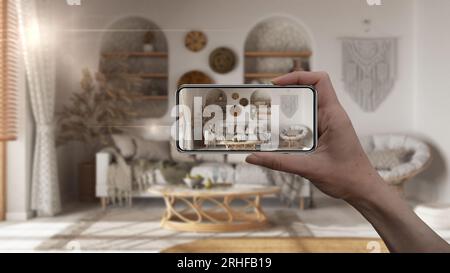 Hand holding smart phone, AR application, simulate furniture and interior design products in real home, architect designer concept, blur background, l Stock Photo