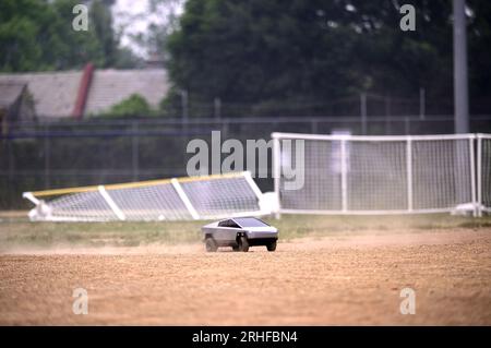 RC Cybertruck stirs dust on a baseball infield, its aimless path a reflection of uncertainty, a metaphor resonating amidst ongoing economic challenges Stock Photo