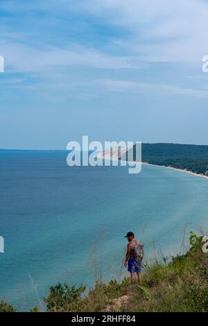 Hiker at Sleeping Bear Dunes National Seashore with Lake Michigan from Empire Bluffs, Michigan Stock Photo