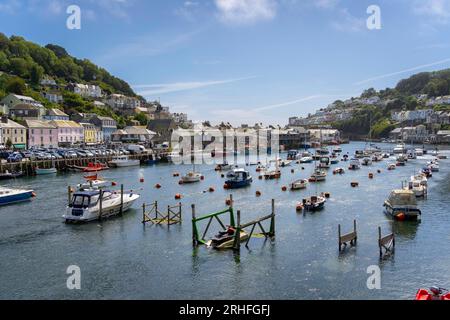 Looe, UK - August 2023: Looe harbour and the East Looe river, separating East and West Looe in Cornwall Stock Photo