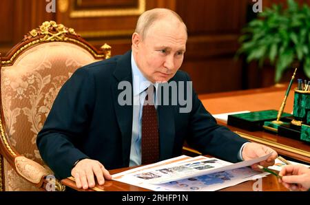 Moscow, Russia. 14th Aug, 2023. Russian President Vladimir Putin listens to the Rosatom CEO Alexey Likhachev, during a face-to-face meeting at the Kremlin, August 14, 2023 in Moscow, Russia. Credit: Alexander Kazakov/Kremlin Pool/Alamy Live News Stock Photo
