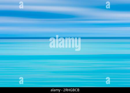 Abstract seascape with panoramic motion combined with long exposure. The image shows the different shades of blue and turquoise that make up the sea a Stock Photo