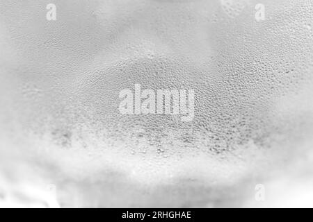 Ice cold glass. Water vapor on cold glass. Fresh water with ice cubes, background. Covered with water drop condensation Stock Photo