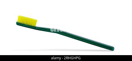 Photo of a green toothbrush isolated on a white background. Stock Photo