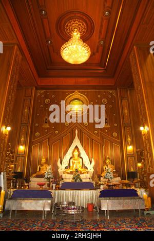 Luang Pho Mongkhon Nimit is Buddha of the posture of Mara, carved from the whole stone, is considered a sacred god that worship at Wat Nong Phong Nok. Stock Photo