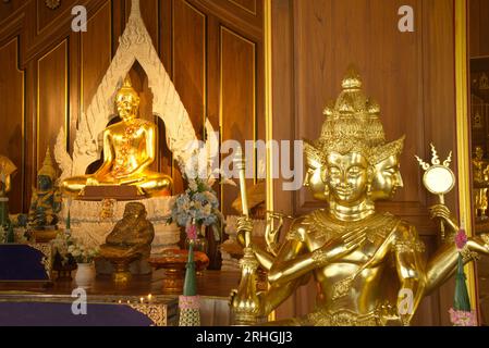 Luang Pho Mongkhon Nimit is Buddha of the posture of Mara, carved from the whole stone, is considered a sacred god that worship at Wat Nong Phong Nok. Stock Photo