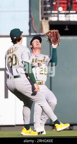 Oakland Athletics' Brent Rooker, right, runs toward home plate after a ...