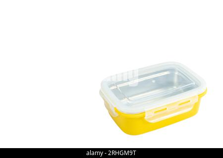 Yellow closed plastic lunch box case isolated on a white background Stock Photo
