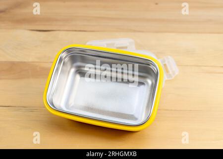 New empty stillness steel lunch box on a wooden background Stock Photo