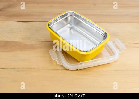 School or office empty lunch box on a wooden table Stock Photo