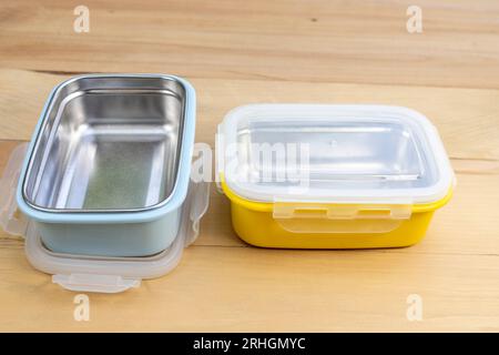 Metal empty stillness steel lunch boxes with on a wooden background Stock Photo