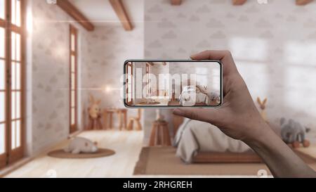 Hand holding smart phone, AR application, simulate furniture and interior design products in real home, architect designer concept, children bedroom w Stock Photo