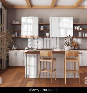 Farmhouse vintage wooden kitchen in white and beige tones with island and stools. Parquet floor, shelves and cabinets. Colonial interior design Stock Photo