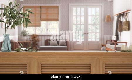 Wooden table top, cabinet, panel or shelf with shutters close up. Olive branch in vase and candles. Blurred background, scandinavian living room with Stock Photo
