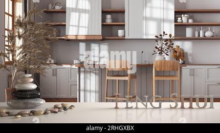 White table shelf with pebble balance and 3d letters making the word feng shui over scandinavian farmhouse kitchen. Zen concept interior design Stock Photo