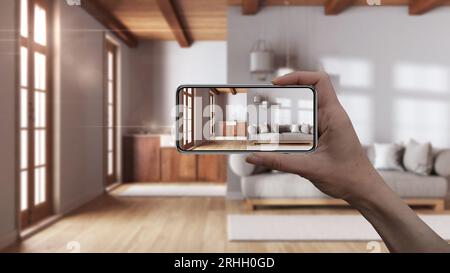 Hand holding smart phone, AR application, simulate furniture and interior design products in real home, architect designer concept, blur background, l Stock Photo